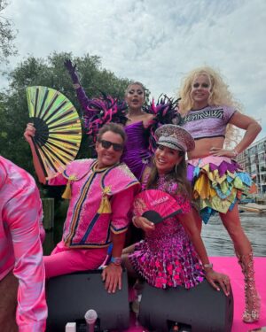 Courtney Act Instagram - What a glorious pride you have, Amsterdam! Thank you for a magical day and thank you to @missenvyperu and @rtl.nl for having me. 

The parade happens on the canal, the pride floats literally float down the water as hundreds of thousands of people cheer from the shore. There are about 26 bridges along the route which, as you will see in these videos, every few minutes everyone has to duck to avoid decapitation, the inflatables have come down, and then we emerge out the side to new crowd of people. Such a fun and unique pride parade! 

Looking forward to performing and hosting The Dam Stage today for the Closing Party! #amsterdampride