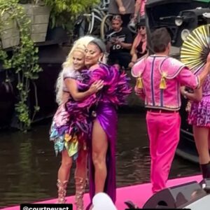 Courtney Act Instagram - What a glorious pride you have, Amsterdam! Thank you for a magical day and thank you to @missenvyperu and @rtl.nl for having me. 

The parade happens on the canal, the pride floats literally float down the water as hundreds of thousands of people cheer from the shore. There are about 26 bridges along the route which, as you will see in these videos, every few minutes everyone has to duck to avoid decapitation, the inflatables have come down, and then we emerge out the side to new crowd of people. Such a fun and unique pride parade! 

Looking forward to performing and hosting The Dam Stage today for the Closing Party! #amsterdampride