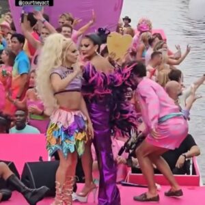 Courtney Act Instagram - What a glorious pride you have, Amsterdam! Thank you for a magical day and thank you to @missenvyperu and @rtl.nl for having me. 

The parade happens on the canal, the pride floats literally float down the water as hundreds of thousands of people cheer from the shore. There are about 26 bridges along the route which, as you will see in these videos, every few minutes everyone has to duck to avoid decapitation, the inflatables have come down, and then we emerge out the side to new crowd of people. Such a fun and unique pride parade! 

Looking forward to performing and hosting The Dam Stage today for the Closing Party! #amsterdampride