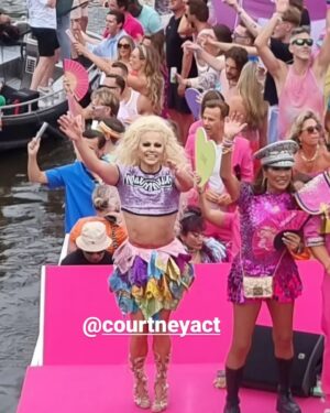 Courtney Act Instagram - What a glorious pride you have, Amsterdam! Thank you for a magical day and thank you to @missenvyperu and @rtl.nl for having me. 

The parade happens on the canal, the pride floats literally float down the water as hundreds of thousands of people cheer from the shore. There are about 26 bridges along the route which, as you will see in these videos, every few minutes everyone has to duck to avoid decapitation, the inflatables have come down, and then we emerge out the side to new crowd of people. Such a fun and unique pride parade! 

Looking forward to performing and hosting The Dam Stage today for the Closing Party! #amsterdampride