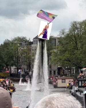 Courtney Act Instagram - What a glorious pride you have, Amsterdam! Thank you for a magical day and thank you to @missenvyperu and @rtl.nl for having me. 

The parade happens on the canal, the pride floats literally float down the water as hundreds of thousands of people cheer from the shore. There are about 26 bridges along the route which, as you will see in these videos, every few minutes everyone has to duck to avoid decapitation, the inflatables have come down, and then we emerge out the side to new crowd of people. Such a fun and unique pride parade! 

Looking forward to performing and hosting The Dam Stage today for the Closing Party! #amsterdampride