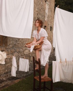 Courtney Halverson Instagram - It’s been awhile, but I still remember this unkind message I recieved. I’d shared my laundry drying in a hotel room in a photo and received a message to the effect of “this whole romanticizing thing is so insufferable. It’s just clothes drying in a bland room”. But I’ve always felt - there’s a kind of magic in finding the beauty in the ordinary, isn’t there? 

I think, if nothing else, my camera roll is a testament to that. Sure, there are the big moments; the sweeping views, the vacation photos, the special occasions and dressed up events. But in a much greater quantity there are the “in-betweens” as I call them; the flowers and weeds growing in equal measure on our hillside, the pasta I threw together for lunch that looked nice on our windowsill, my morning coffee in bed, and yes - photos of the way the light happened to fall on my laundry drying one very ordinary day.

So while this isn’t exactly an ordinary moment (hello dreamy laundry line in Tuscany) I hope it serves just a little as a love letter to all the “in-betweens” I capture and treasure.
.
.
.
photos by the lovely @leanneansar | wearing @shopdoen and @rouje 🤍 #romanticstyle #underthetuscansun #feminineenergy #laundryline 
.
.
ps : so many of you have asked and I’m pleased to share that my locket with @monicarichkosann is coming back this month. It’s been a dream to see how many of you fell in love with it the first time, and I wear mine daily. So thrilled to be able to share it again! 🐚