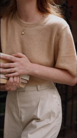 Courtney Halverson Instagram - Headed into autumn with my usual stack of books that I swore I’d read over the summer. 📚 Slowly easing into the season ahead in new chinos & a cozy cashmere knit from @bananarepublic. 
.
.
.
#romanticstyle #fallfashion #bananarepublicpartner