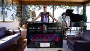 Daniel Johns Instagram - I’m notoriously bad at stopping and smelling the roses so I’m putting this here to remind myself.

This will be my final post for 2023 so I can go away to work on finishing orchestration and credit sequence for ‘What If The Future Never Happened?’. I’m shutting my socials down, putting my phone in a drawer and getting back to work. 

FutureNever was the most gratifying creative experience of my career, it was gratifying because of YOU all. I’ve never felt more connected to the people who have supported the podcast, the album and the exhibition. ‘What  If The Future Never Happened?’ is coming in early 2024, I’m disappearing into the studio now to finalise the orchestration. 

In pretty big personal news, I’ve just signed the most important songwriting deal of my career with BMG, including all of my songs from ‘Frogstomp’ to ‘FutureNever’ and everything in between. 

The team @bmgausnz also just came up to my house and presented me with this wild plaque celebrating FutureNever being announced as ARIA’s highest selling new Australian Album of 2022, spending 7 weeks in the Top 10 (and 2 weeks at #11 😂) and going #1 twice. I don’t really hang plaques in my house but I’m hanging this one in my living room because it’s a reminder of the love from you all and it means more than you’ll ever know. It also lights up.

Although it’s a solo album, FutureNever had many collaborative elements and I’ve been sharing the @aria_official trophies presented to my dear friends who helped create FN.

Thank you to @eddiezammit @allaboutgraphics BMG and @rialtomelbourne - because in mind blowing news ‘Past, Present and FutureNever’ has won 2 awards at the FESPA’s in Munich @fespagram - beating out the FIFA World Cup for the coveted ‘Best In Show’ Award.

Thank you also to @spotifyaunz for this epic plaque commemorating the global success of ‘Who Is Daniel Johns?’. Thank you to the @australianpodcastawards for the ‘Spotlight Award’. 

Thank you to @ausindies for awarding FutureNever Best Pop Album in 2023. I’m loving being a truly independent artist making everything on my own terms.

Love you, I’ll find you in the NeverAfter 💕
