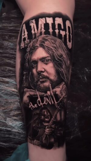 Danny Kiranos Instagram - If you haven’t listened to @amigothedevil this is your sign to start. I’m stoked to see him perform again in a couple days! Thank you so much for traveling and trusting me to do this for you, Gina. #amigothedevil #blackandgrey #realismtattoo #tattooartist