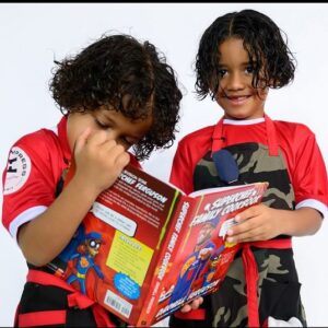 Darnell Ferguson Instagram - It’s the holiday season and the new kids aprons from @rockchef2impress are out!! Whether they are cooking in the kitchen or doing kid friendly task! Also get them a copy of #superchefsfamilycookbook @barnesandnoble #gifts #holidayshopping #giftwrapping #christmas #superchefgrudgematch #superchef