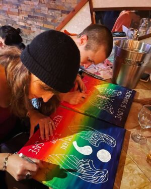 Dominique Provost-Chalkley Instagram - With the goal of continuing to create positive change around the world, KK Foster has created two paintings inspired by and in celebration of Emy’s new album, “Everything Is Love” and the beautiful songs that we all get to enjoy, including Everything Is Love, Pride Liberates, and Keeping Me Safe. These paintings have been signed by Emy Taliana and myself and are being auctioned off to the highest bidders with all the money raised going to Start the Wave. 🦋 These are two separate paintings and therefore, you can bid for either one or both, separately. Below you will find the bidding guidelines. 

Painting Bidding Guidelines:

🌈 Bidding will start today, 28th at 11.11am.
🌈 Each item will start at $11.11 and will be a silent auction.
🌈 Bidding will run for 3 days, ending Sunday at 8pm.
🌈 You can bid separately for each signed painting. 
🌈 Please specify which piece you are bidding on: Everything Is Love/Pride Liberates piece OR Keeping Me Safe piece.
🌈 DM your bid to KK at @kkfosterlyrics — Any bids made elsewhere will not be counted. Please ensure to DM KK!
🌈 Each day, KK will update in her stories what the current highest bid is for each piece. If you so choose to bid higher, you can DM her again. 
🌈 Bidding will close at 8pm EST on the third day.
🌈 The two winners with the highest bids will be notified the following day. 
You will then Venmo KK the payment and she will make the donation to Start the Wave for the total amount. 
🌈 Once payment is received, KK will communicate with the winners, package up and ship the paintings out to their destinations. 

Thank you for your support! 
#startthewave #stwfundraising #everythingislove #prideliberates #stwcreativity @start_the_wave @kkfosterlyrics @emytaliana