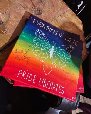 Dominique Provost-Chalkley Instagram - With the goal of continuing to create positive change around the world, KK Foster has created two paintings inspired by and in celebration of Emy’s new album, “Everything Is Love” and the beautiful songs that we all get to enjoy, including Everything Is Love, Pride Liberates, and Keeping Me Safe. These paintings have been signed by Emy Taliana and myself and are being auctioned off to the highest bidders with all the money raised going to Start the Wave. 🦋 These are two separate paintings and therefore, you can bid for either one or both, separately. Below you will find the bidding guidelines. 

Painting Bidding Guidelines:

🌈 Bidding will start today, 28th at 11.11am.
🌈 Each item will start at $11.11 and will be a silent auction.
🌈 Bidding will run for 3 days, ending Sunday at 8pm.
🌈 You can bid separately for each signed painting. 
🌈 Please specify which piece you are bidding on: Everything Is Love/Pride Liberates piece OR Keeping Me Safe piece.
🌈 DM your bid to KK at @kkfosterlyrics — Any bids made elsewhere will not be counted. Please ensure to DM KK!
🌈 Each day, KK will update in her stories what the current highest bid is for each piece. If you so choose to bid higher, you can DM her again. 
🌈 Bidding will close at 8pm EST on the third day.
🌈 The two winners with the highest bids will be notified the following day. 
You will then Venmo KK the payment and she will make the donation to Start the Wave for the total amount. 
🌈 Once payment is received, KK will communicate with the winners, package up and ship the paintings out to their destinations. 

Thank you for your support! 
#startthewave #stwfundraising #everythingislove #prideliberates #stwcreativity @start_the_wave @kkfosterlyrics @emytaliana