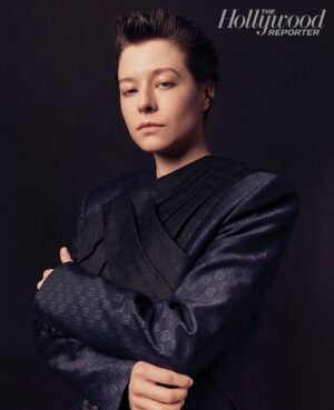 Emma D'Arcy Instagram - @hollywoodreporter roundtable !

(so nervous I’d entered a fugue state)

altar boy by @rosefordestudio 
royal blues by @balmain 
quiff by @mirachai 
new face by @hollysilius 
photo by @still_charlie 

[image description: a portrait photograph of Emma, wearing a navy blue Balmain blazer, with a black sash across the chest. Their arms are folded across their body. Emma’s dark hair is spiked up. They look to camera.]