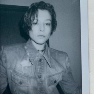 Emma D'Arcy Instagram - HotD NYC 🗯️🗯️🗯️🗯️🗯️

Curated / directed / theme tune by @rosefordestudio 
Denim sculptures by @egon_lab 
And day-in-the-wild face @hollysilius 
w best hair-through-a-hedge by @adammarkarian 
(cut always by @jodytaylorhair )
Perfect metal by @justineclenquet ⚔️

And holding my hand @dobbscld   @dfm16

[image description: A non-binary person looks to camera - their head down to their waist is visible.  They wear a worn, faded denim jacket that is fitted and has extreme shoulder pads. They wear a spiked metal choker. Their hair comes to their jaw and is oily and wind-swept.]
