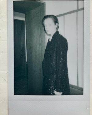 Emma D'Arcy Instagram - HotD NYC 🗯️🗯️🗯️🗯️🗯️

Curated / directed / theme tune by @rosefordestudio 
Beaded @celine all over ~
w a face by artist @hollysilius 
and hair for a party by @adammarkarian 
(cut always by @jodytaylorhair )
Radical gems by @alancrocetti 

And holding my hand @dobbscld   @dfm16   @houseofthedragonhbo gang

[image description: a white non-binary person stands in a doorway - their body is in profile but their face is turned to camera. They wear black tie by Celine. Their short hair is slicked to the side. They wear a long black beaded coat, over a white shirt and a thin black tie. They wear loose fitting leather trousers, over heeled black boots.]