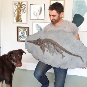 Fiann Smithwick Instagram - Trying to teach the dog about fossils. I don't think Tia quite gets the awesomeness of this fossil, or the fact that it's nearly 200 million years old. It's one of the best I've found, a perfect juvenile ichthyosaur from the Jurassic Coast. 
🏖🌊🏖🐬
I've not been fossilising for far too long. I've been working on another project for the past few months, which is fossil related and pretty cool, but I can't reveal anything about it yet! I'm getting the urge to go collection again though...

#fossil #fossils #art #geology #palaeontology #paleontology #paleo #curiosity #ancient #history #collect #collection #animal #animals #evolution #science #museum #jewel #collecting #treasure #dog #jurassiccoast #dorset #teaching #rare #dinosaur #age #dinosaurs #ichthyosaur #bones