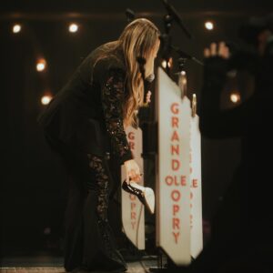 Gabby Barrett Instagram - What an unforgettable night! So incredibly happy and grateful that I got to play the Grand Ole Opry. 🤍 
I was supposed to make my debut in 2020, but then Covid happened and pregnancies, etc. so a piece of my heart is officially filled ✨

our tour starts this week in Kansas, go grab your tickets at the link in my bio to come see us on the road this year 🤎

Stylist: @tiffanygiffordstyle 
Suit: @cinqasept @starstruckvintage @fablesbybarrie 
Shoes: @stevemadden 
Jewelry: @nicolerosejewelry @yayapublicity