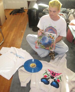 George Clanton Instagram - Ayy yo real quick 
I gotta shout out The band i just went on tour with, deaths dynamic shroud, for being excessive and dropping 3 albums of new music all at once today. Here is a photo of me holding “Midnight Tangerine” which is available starting today from 100percentelectronica.com along with “Keys to the Gate” and “Transcendence Bot,” all by @ddsnuwrld 

Also last night on the @100percentelectronica stream we launched some new clothing including a one-time-only preorder for those ElectroniCON shirts. They sold out on day 1 and I know that disappointed so many of the day 2 people, as well as the artists that missed out — so we are doing another print for preorder only. 

Anyway you can find all that on www.100percentelectronica.com which is linked in my story most days