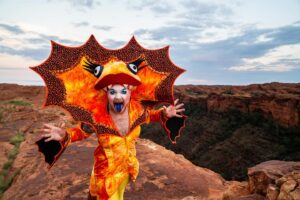 Ginny Lemon Instagram - “A cock, in a frock, on a rock, IN CROCS!”

In honour of the 30th anniversary of The Adventures of Priscilla, Queen of the Desert me and my sisters @officialsistersister @queenutica and @joeyjayisgay were given the fantastic opportunity to re-enact the final scene by claiming up Kings Canyon in full drag to commemorate 30th years of this iconic Australian drag masterpiece of cinema, a cult classic and any drag queens favourite. 

I could never in my wildest dreams believe that I would be lucky enough to be chosen for this, proper have to pinch myself. 

Also when they said “hey do you wanna do a photoshoot up Kings Canyon” I never thought about ACTUALLY walking up there, in FULL DRAG at 4am in the DARK! But we did it! To watch the sunrise in one of the most beautiful places on earth, was an absolute honour. 

Big love and shoutout to the amazing team who were with us the whole way and put up with my Diva fits @thekassieh @with.all.drew.respect  and @discoveryparksandresorts

Shot by @kanechenoweth on location at @watarrkanationalpark 🏜️

#ntaustralia @ntaustralia

Travel #sponsored by @australia 

#SeeAustralia