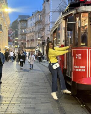 Harleen Sethi Instagram - Not to be tram-atic, but Trams have always fascinated me.. From old pictures & videos of Bombay to the ones we see in films that are shot in Calcutta, trams remind me of the more simpler times..

More than the landmark attractions in Europe, I love travelling in trams to soak in the new place whilst being on the journey.. Seeing a passing view of different streets, locals, street foods, clothes & crockery shops, harbours, mosques, cafes, stations, people waiting, people rushing wanting to get somewhere etc.. 

Everytime I would see a tram approaching from nowhere, I would jump right in on the tracks to get a shot and then see it pass by me into the horizon of the crowds, leaving the trail of the city a little bit sorted.. Istanbul trams were straight outta my dreams 💟