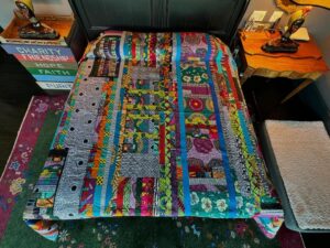 Harvey Fierstein Instagram - Decided that I needed a change so I pulled this quilt that I made last year out of the pile and put it on the bed. I love it. Nothing fancy about it, but the fabrics are all so wonderful. They are African wax prints. Inspirational. I can’t wait to see what dreams come my way as i sleep under this.