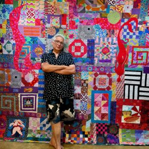 Harvey Fierstein Instagram - A friend asked if he was ever going to get a quilt of mine. I reminded him that he lives in a small studio apartment. His response was, "SO?"
So, I offer a photo of my 6' self standing in front of one of my quilts in answer to his question.
Photo thanks to Lisa Kuller