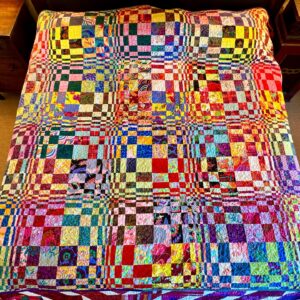 Harvey Fierstein Instagram - Just finished quilting and binding this Queen sized beauty.
 It's a pattern by Carol Thelan on YouTube. What I love is that it appears to be curved but that's just an optical illusion. All the pieces are straight. Fun?