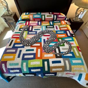 Harvey Fierstein Instagram - Just finished this GARDEN OF EDEN quilt! I quilted most in a Jungle leaf motif, which I love juxtaposed on the geometrics, and then, as you might be able to see, I stuffed the snake a bit to give it a 3D effect. It's so wonderful on a bed. Love it. On to the next quilting adventure!