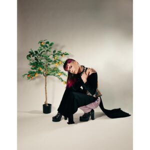 Ian Alexander Instagram - 💛 CHANH / LEMON 🍋
my photoshoot with @hanz.a is very near and dear to my heart ✨❤️‍🔥 i’m grateful to share my Vietnamese heritage with u. 
lemons have a special meaning to nonbinary Viets. a new gender neutral pronoun, directly translating to “lemon,” was created from chị   anh = chanh (feminine pronoun/sister   masculine pronoun/brother = lemon). 🍋 
our culture is constantly growing and evolving: i will never forget my roots, and the fruits that my tree bears will be dazzling to taste.
~
📸 photography: the incredible @hanz.a 
💡lighting: always slaying @maevellisullivan 
💋 makeup, hair, styling: me!
👗 áo dài: AoDaiThuyAnh
💎 necklace : @fruitflyforever 
👚 corset: custom @retrofolie corset using a Đông Hồ painting titled “Rat Wedding”
👢 shoes: @azaleawangofficial