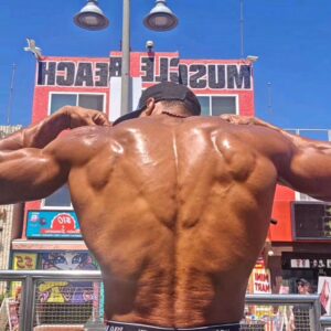 Ike Catcher Instagram - We Back like that! #biggestmanonthebars #back 
Spreading my lats like they are wings Sit in the sun  like im the sphinx #ikeCATcher #kingofmusclebeach