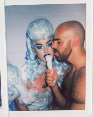 Ilona Verley Instagram - “Walk your ass on a leash, here's a treat”
🐩🐩🐩🐩
Y’all have been AT ME to get the poodle look back up and I swear I never meant for it to be MIA for so long but I’m very happy to finally be putting it back up, this time with some never b4 seen Polaroid’s!
🐩🐩🐩🐩
This was the one look I got to wear on drag race (other than promo and entrance haha) that really showcased my brand and the type of drag I love to do, it made me so happy how much everyone else loved it!
🐩🐩🐩🐩
Hair: @ardawigscanada styled by me!
Outfit: @hauszuk (with the help of many that stoned all the paw prints (tbh I legit forget who all helped rip)
Hot: @johnnywalkersfitness 
🐩🐩🐩🐩
#canadasdragrace #poodle #poodlefashion #poodlewig #poodlehair #bluepoodle #trans #queer #pvc #pvcfashion #pvcclothing