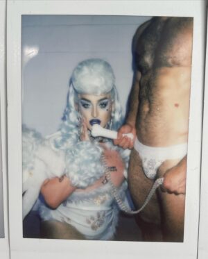 Ilona Verley Instagram - “Walk your ass on a leash, here's a treat”
🐩🐩🐩🐩
Y’all have been AT ME to get the poodle look back up and I swear I never meant for it to be MIA for so long but I’m very happy to finally be putting it back up, this time with some never b4 seen Polaroid’s!
🐩🐩🐩🐩
This was the one look I got to wear on drag race (other than promo and entrance haha) that really showcased my brand and the type of drag I love to do, it made me so happy how much everyone else loved it!
🐩🐩🐩🐩
Hair: @ardawigscanada styled by me!
Outfit: @hauszuk (with the help of many that stoned all the paw prints (tbh I legit forget who all helped rip)
Hot: @johnnywalkersfitness 
🐩🐩🐩🐩
#canadasdragrace #poodle #poodlefashion #poodlewig #poodlehair #bluepoodle #trans #queer #pvc #pvcfashion #pvcclothing