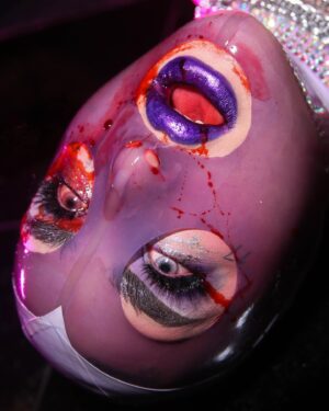 Ilona Verley Instagram - “Don’t get sad, Get Even”
😈😈😈😈
CW! Fake Blood!
😈😈😈😈
Halloween might be over but y’all know @kikiwannakaikai & I had to keep the spookening alive!
😈😈😈😈
Brows: 
@aboutfacebeauty 
Brow Artist in Black Brown
Fractal Glitter Brow in interlude
Eyes:
@morphebrushes Nyane Fierce Fairytale palette 
@litcosmetics Ice Princess Glitter Mix
Lips:
@kvdbeauty Glimmer Veil in Televator (rip to this discontinued fav of mine)
😈😈😈😈
Latex Hoods are from @deadly_couture (lavender one dyed by me!)
Choker’s we’re a harness from @jqclothingltd I stoned and cut up!
Photos by @hauszuk !
😈😈😈😈
#latexhood #latex #blood #fakeblood #purpleeyeshadow #purplehaloeye #purplelipstick #drag #dragqueens