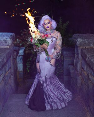 Ilona Verley Instagram - “Not everybody lives, but everybody dies”
🥀🥀🥀🥀
It’s been what, 3 years since CDR S1?
And I’m JUST NOW finishing posting all the photos from that era in my life…
I deleted / archived everything from drag race shortly after the show aired because I had such a tumultuous relationship with CDR and my experience that the photos and the looks from that era were things that hurt me…
When I started healing my relationship with myself and ultimately that experience, I started to feel more comfortable with the photos and been trying to repost them, but as we all have seen my feed aesthetic has made that hard and controls the way I have been posting…
ANYWAYS, finally my elimination photo is back on my feed and I can end this era on a happier note this time around
🥀🥀🥀🥀
Last slide is my original credits and caption from the first time this photo went up
🥀🥀🥀🥀
Photos and original edit @thedragseries 
Updated edit: meee
Shoot assistant: @japantara 
Hair: @awesomebitchwig 
Dress originally by @ms_misty_meadows modified by myself and Steph
Jewelry by that one Pidge company 
🥀🥀🥀🥀
#canadasdragrace @canadasdragrace #cdr #ilonaverley #purplehair #draghair #dragwig #pageanthair #gown #lavender #firephotography #opulence