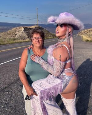 Ilona Verley Instagram - “You were a mirage, you’re not really there”
🐎🐎🐎🐎
Inspired by @slayyyter & the cowboys music video!
🐎🐎🐎🐎
This look was originally made for me a few years ago by @connormccalden who did up the chaps/ bra & gloves for me when I was in Toronto for a few months and running out of outfits at the time!
I later made the hat and the bodysuit to go with it & @hauszuk helped me stone everything! 
🐎🐎🐎🐎
I’m so happy to have finally gotten to shoot this look & to do it with my incredible mom @sandiverley who took off a whole weekend to drive us up home to the canyon and literally camp until it was cool enough for us to drive to the ghost town to actually shoot… our one day trip turned into a 3 day adventure!
THANK YOU MOM!
🐎🐎🐎🐎
Hair was done for me the MORNING of by @the.girlfriendexperience
Also a big shout out to sheisbliss for helping me stone and get myself together that morning as well!
Hat was originally from @rockin_cowboy_clothing_company painted and transformed by me! (Reel coming soon on the DIY) 
Boots were from @onlymaker_shoes transformed by sheisbliss & myself! 
Earrings by @sadndn_ 
🐎🐎🐎🐎
I used to try to be so independent and do everything myself, but the last little bit, I’ve been giving up the perfection complex of wanting to do it all alone & it has helped me see that creating is not only easier but much more rewarding when you work with others, especially the people you LOVE!
The funny thing is to me the most perfect art has been the stuff I’ve done with friends… not the stuff I’ve done alone… (learning lesson for those struggling with giving up control / dealing with the typical artist perfection complex) 
🐎🐎🐎🐎
#cowgirl #cowgirlfashion #cowboyhat #purple #lavenderhair #humanhairwig #drag #dragqueen #purplemakeup #onlymaker #festivalfashion #ravegirl #ravegirls