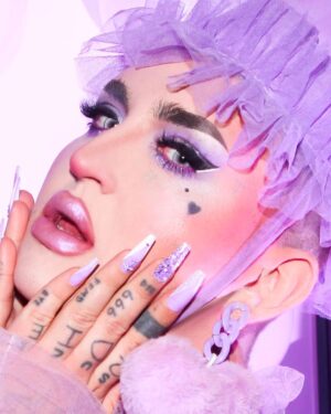 Ilona Verley Instagram - “Maybe if I knew all of them well,
I wouldn't have been trapped inside this hell that holds me”
💜💜💜💜
I survived the 27 club!
As silly as it may seem it’s always been something that has haunted me, 7’s and death have been prominent in my life and the whole concept of the 27 club had me feeling ANXIOUS this past year if we r being REAL!
💜💜💜💜
I’m now going into the last couple years of my 20’s feeling secure in the version of myself I am now and feeling a lot of clarity around my relationships and what I am able to bring to the table in terms of self identity and accountability.
I’m truly feeling free and truly feeling happy.
I’m so close to the person i used to fantasize about being, my dreams are slowly becoming my reality and that is the best birthday present I could ever ask for!
💜💜💜💜
Photos: @allthatbeth_
Ruffled coat : @evanclayton 
Matching accessories: by me 
Earrings: @vexdesigns.ca
Nails: @kissproducts
💜💜💜💜
Face:
@kryolanofficial paint sticks NB2 & TV White
@rcmamakeup colourless powder
@kvdbeauty Contour palettes 
@limecrimemakeup hi-lite mermaids palette
Eyes:
@colourpopcosmetics Fade Into Hue palette
@litcosmetics Party Girl Glitter
@limecrimemakeup Liquid Liner in Baby’s Breath & Black
Lips:
@kvdbeauty Lolita 
 
@limecrimemakeup Hi-lite Mermaids over top
Brows:
@kvdbeauty Medium Brown pomade 
💜💜💜💜
#dragqueen #drag #purplemakeup #glittereyes #glittermakeup #graphicliner #limecrime #kvdbeauty #canadasdragrace #lavenderhaze