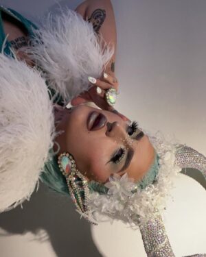 Ilona Verley Instagram - “Fallen Angel, you want me to be done”
✨✨✨✨
The last couple months I’ve found myself going over my experience with @worldofwonder and thinking about how I let the actions of a handful of people shape my view on something I once loved.
I wouldn’t be the out and proud queer trans person I am today if I had never found @rupaulsdragrace …
When we filmed in 2019 I was lost and scared and thought that the show was going to save me and fix all of my problems, I projected my insecurities onto the experience thinking it was going to change my life instead of seeing that I was and still am the only person that I need to change my life, it’s not someone else’s responsibility.
This year I’m moving forward with that mentality, everything I want and I need I’m going to work towards and make happen myself with out relying on other people or experiences in an unhealthy way to get me to where I want to be! Of course we all need our support networks and I am beyond thankful for mine, but I’m not going to rely on them more than I rely on myself & am going to hold myself accountable for keeping healthier relationships going forward!
✨✨✨✨
Hair & photos by The Drag Series
Assisted by @kelsifer888
Look designed by myself & @evanclayton
Made by @rosegoldblunt
Horns by that girl I blocked ‘s boyfriend & @theonethatsugly
Location: @fairmontvan 
Leather: @creepyyeha
Shoes, wraps & ears by me!
✨✨✨✨
#canadasdragrace #dragrace #drag #mintgreenhair #elfears #euphoriamakeup