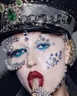 Ilona Verley Instagram - "I'm on everyone's radar
I bet that's why they hate her"
💎💎💎💎
The first time I remember being so inspired that it shaped me as a human was witnessing @brookecandy 's Opulence era unfold in real time.
I was just getting into drag at the time and to this day those looks and that song have had such a grip on me and my aesthetic!
Over the years I've recreated various looks from Brooke's Opulence era, always wishing I had the resources to do them better.
I sat down this week and revisited the OG inspo, the @papermagazine cover and was able to bring my interpretation to life in a way I can finally say I am so proud of! 
If you swipe to the end you'll see the first time I ever tried to take on that look... I was 20 years old, had some dollar store rhinestones and a DREAM. 
💎💎💎💎
Hat by me! 
Jewelry is all left over shit from my drag race package 
Head wrap was made by @evanclayton
Photos by @the.Alma.be
Nails are @kissproducts
💎💎💎💎
#dragrace #ilonaverley #drag #brookecandy #opulence #festivalfashion #festivalmakeup #creativemakeup #ABcrystal