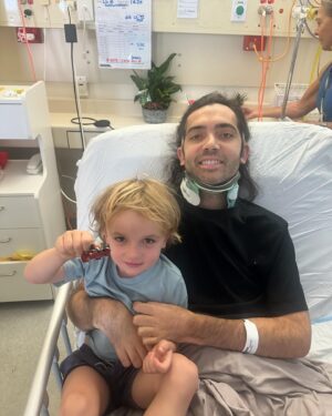Jaimen Hudson Instagram - A week ago on my way to the beach I fell heavily out of my chair and have broken my neck for the second time. After spending the night in Esperance Hospital, I was flown to Royal Perth hospital by the Royal flying Dr Service.
Upon arriving in Perth, I had a traction system screwed into the side of my temples, and then a 4 1/2 kg weight hung off of the back to stabilise my neck.
I was in that system for approximately 2 1/2 days before going into surgery on Thursday to fuse my neck.
The surgery took about 6 1/2 hours and I’m so grateful to say it was successful. I have been very very, lucky not to lose any of the function that I had.
As you can imagine, this has been a very harrowing week for not only myself, but also my family.
I’ve been so incredibly lucky to have my beautiful wife, children, sister, mother, father as well as their partners by my side through the whole experience. 
Never once have they left me on my own. 
I also have such incredible friends that came and picked me up out of the dirt when I fell and took me to where the ambulance could collect me. Then a great group of friends that have also helped by supporting us through this week. It really means the world to me. 
All the nursing and medical staff have been incredible as well.
I will film a video and update you all in more detail at a later stage, but I just wanted to let you know I am okay and heading in the right direction.
You can break my stride, but never my spirit xx. I’ll be back doing all the fun shit I love to do and sharing it with you all again soon.
Love you all, Jaimen