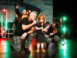 Jimmy Barnes Instagram - Lying around recovering, I’ve been looking through some old photos. Here’s a great one from five years ago after I wrote ‘Och Aye the G’nu’. It was written for Dylan and here he is performing with us at the Variety Kids Christmas Party. Now here’s a gorgeous Scottish kid if ever I saw one.