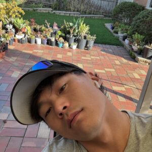 John Harlan Kim Instagram - Being raised in a single parent-single child household should have meant zero competition for love but my mother is honestly more proud of her garden than she is of me and I think it’s because I was a goth in high school. She also is not a fan of my new Asian mullet.*

*this is a joke. Me Mum loves me. I’m an absolute legend.