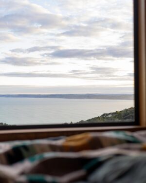 Jordi Webber Instagram - Escaped the noise for a couple of days.

After 2 months of backpacking, my soul needed stillness ⛰️

So I had a couple of nights in the hills at an @unyoked.co cabin in Raglan 🤙🏽

Birds singing all day 🦜, sweet view of the moana 🌊 and a beautiful space 🏠
Feelling very Zen 🧘🏽

Remember to listen your body, and if you’re a stranger to doing solo missions in the hills for a few days - give it a go, you might just fall in love with it 🌞🌿