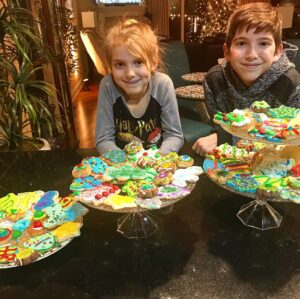 Kadan Rockett Instagram - Not showing our teeth because our mouths are BLUE from eating a few  too many of our creations!  @brooklynrockett @bartrockett #ChristmasCookies #ChristmasTraditions #MerryChristmas #TheMostWonderfulTimeOfTheYear #Christmas2017 #DecoratingCookies #BakingCookies #FamilyTime #MakingMemories #KidMagician #DownTime #FamilyFun