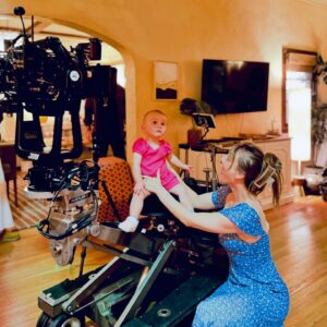 Kaley Cuoco Instagram - When your little lady visits you at work for the first time, it deserves a permanent post ♥️ I dreamed of the classic ‘baby on camera ‘ pic since the day she was born. Maybe she will share this pic in 20 years when she is on the Late Show 😛 📸 Chris Messina