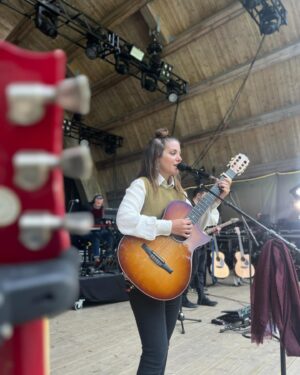 Katie Melua Instagram - This place is unreal! 

Years ago the band and I got to play an underwater gig here, a festival at the bottom of a mine, one of my most memorable shows and today in amongst ancient trees, huge stone cliffs and a waterfall… Norway ❤️

Here’s our soundcheck ahead of @ravnedalenlive.