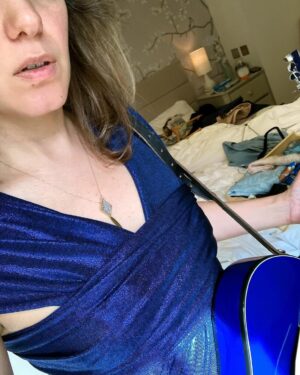 Katie Melua Instagram - Packing for travels and I want the outfits to match the guitar.
Not so easy with a bold azure blue. 
💃🏻😎