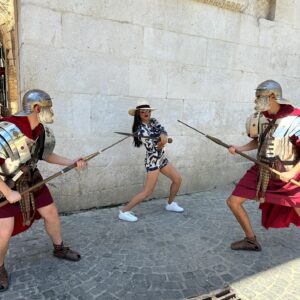 Kelly Hu Instagram - Touring the town of Split today. 

I contemplated actually doing the splits in front of the sign for a nano second before I came back to reality. 

Picked a fight with a couple of Red Guards at the palace.  Needless to say, I won. ⚔️

There seems to be a replica Game of Thrones throne in every Croatian town so far.  I’ll be sitting on all of them.