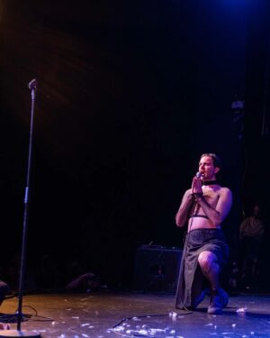 Killian Sundermann Instagram - Just received news I've been defrocked as a result of my performance at Bureau De Change Song Contest Last night. Not sure what to do, my dad said he'll google so will let you know once I get any news. Well done everyone last night we truly showed the world how sordid and filthy our collective minds can be when we put them together. Songs are on Bandcamp all proceeds go to @merchantsquayir . Well done @ali__fox_ deserved winner. The Vatican haven't heard the last from me! Thanks so much forever to @ian_nyquist my amazing composer who created the sexiest italidisco beat you'll ever hear. Please check put his music he's very talented. They can excommunicate me cos i don't communicate with my ex ( aware that makes no sense) thanks for sponsors @nowtvireland and @thecollaborationsagency for organizing and @tonyhorror for birthing this amazing beautiful idea into existence