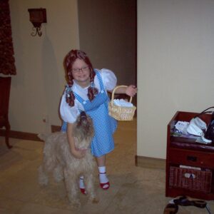 Lauren Potter Instagram - Throwback Thursday Halloween style! Marley was a little too big to be Toto! What are you guys dressing up as this year? #tbt