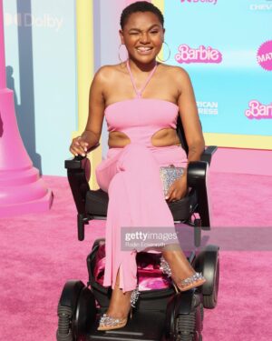 Lauren Spencer Instagram - Hi Barbie!!! 💖Your bestie served as life-size wheelchair Barbie on the pink carpet for the @barbiethemovie premiere! Of course @disabilityfashionstylist did her thang   we made it on a BEST DRESSED LIST! 😝 And @newjackcinema_ wheelchair Barbie chain was a whole fashion moment. Such a special night. It’s a FANTASTIC film and being in the same room with THAT cast was truly inspiring. Ya girl is up next I promise you that (manifesting ✨)   you know my @whill_us is gonna be with me & should be with you too use code: LOLO8 at @scootaround to get yours. 🔗LINK IN BIO #accessiblebarbie #livesololifestyle #barbiemovie