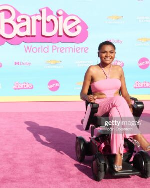 Lauren Spencer Instagram - Hi Barbie!!! 💖Your bestie served as life-size wheelchair Barbie on the pink carpet for the @barbiethemovie premiere! Of course @disabilityfashionstylist did her thang   we made it on a BEST DRESSED LIST! 😝 And @newjackcinema_ wheelchair Barbie chain was a whole fashion moment. Such a special night. It’s a FANTASTIC film and being in the same room with THAT cast was truly inspiring. Ya girl is up next I promise you that (manifesting ✨)   you know my @whill_us is gonna be with me & should be with you too use code: LOLO8 at @scootaround to get yours. 🔗LINK IN BIO #accessiblebarbie #livesololifestyle #barbiemovie