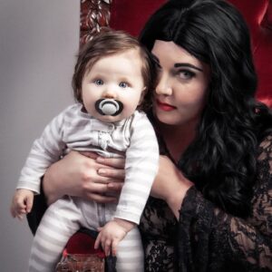 Lindsay Jones Instagram - "We went through all the usual baby names...then we came to our senses. Pubert." Thank you so much to @JonRisinger and @texasdelarosa for once again jumping on board with a fun mother/daughter Addams Family-inspired shoot and for making Pubert (Luna) Jones a reality! 🖤