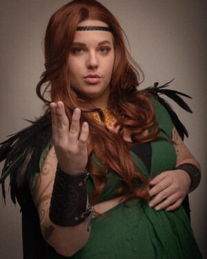 Lindsay Jones Instagram - The photos are in from my second maternity shoot and THEY’RE AWESOME! I wanted to pay homage to Freyja (Freya), Norse goddess of love, fertility, war and death, who is also a mother of two with Odr! Her colors are gold and green, which I implemented into the costume and body paint. Complete with her Brisingamen, feathered cape, sword and shield, she is ready to slay her enemies and her lovers. 
HUGE thank yous to @jonrisinger @texasdelarosa and @andy_blanchard for making this dream of mine a reality! Jon had the brilliant idea to use filters to give them a painted parchment feel. Instagram doesn’t even do these justice. I will be posting more! ❤️