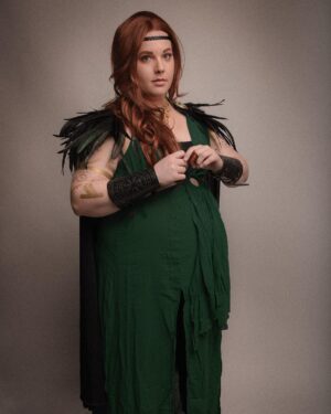 Lindsay Jones Instagram - The photos are in from my second maternity shoot and THEY’RE AWESOME! I wanted to pay homage to Freyja (Freya), Norse goddess of love, fertility, war and death, who is also a mother of two with Odr! Her colors are gold and green, which I implemented into the costume and body paint. Complete with her Brisingamen, feathered cape, sword and shield, she is ready to slay her enemies and her lovers. 
HUGE thank yous to @jonrisinger @texasdelarosa and @andy_blanchard for making this dream of mine a reality! Jon had the brilliant idea to use filters to give them a painted parchment feel. Instagram doesn’t even do these justice. I will be posting more! ❤️